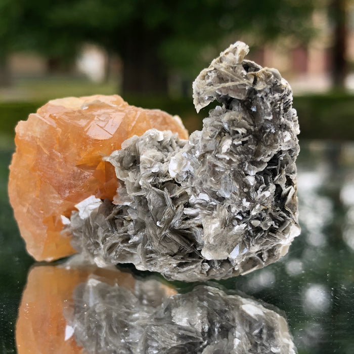 78g 5x3x3cm Snail Shape Orange Scheelite with Silver Muscovite from Mt. Xuebaoding,Sichuan,CHINA