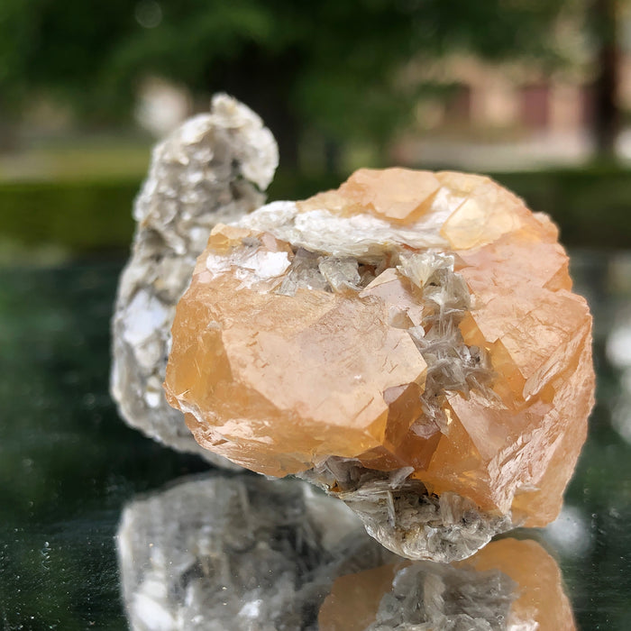 78g 5x3x3cm Snail Shape Orange Scheelite with Silver Muscovite from Mt. Xuebaoding,Sichuan,CHINA
