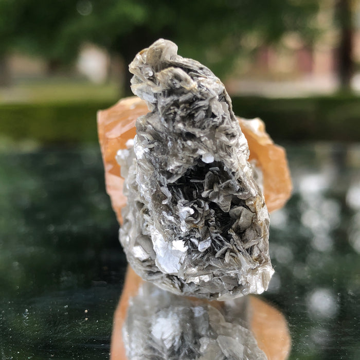78g 5x3x3cm Snail Shape Orange Scheelite with Silver Muscovite from Mt. Xuebaoding,Sichuan,CHINA