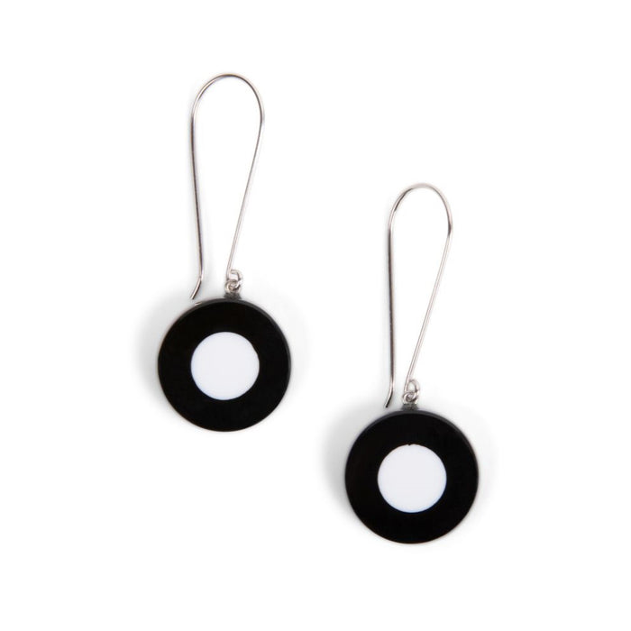 A pair of long wire earrings with black and white beads, isolated on a white background.