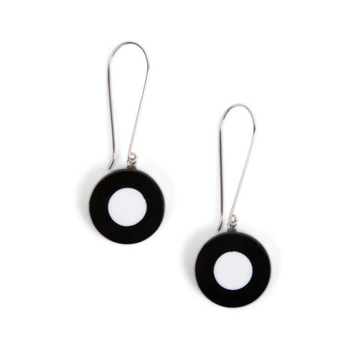 A pair of long wire earrings with black and white beads, isolated on a white background.